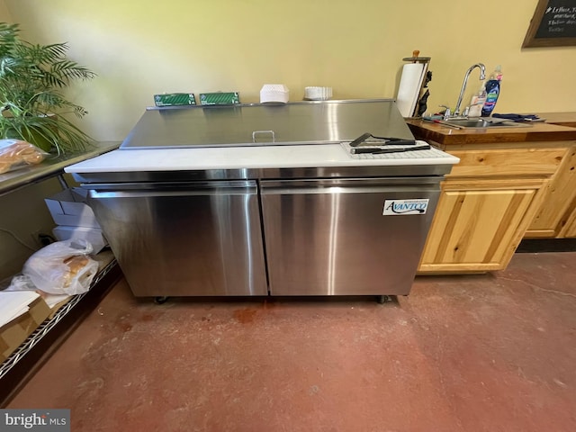 interior space featuring concrete flooring and sink