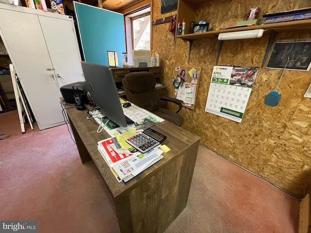 office area with concrete flooring