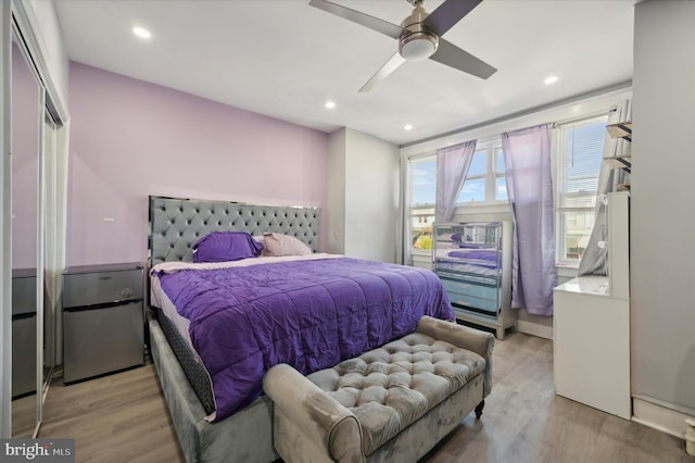 bedroom featuring a closet, ceiling fan, and light wood-type flooring