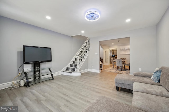 living room with light hardwood / wood-style flooring