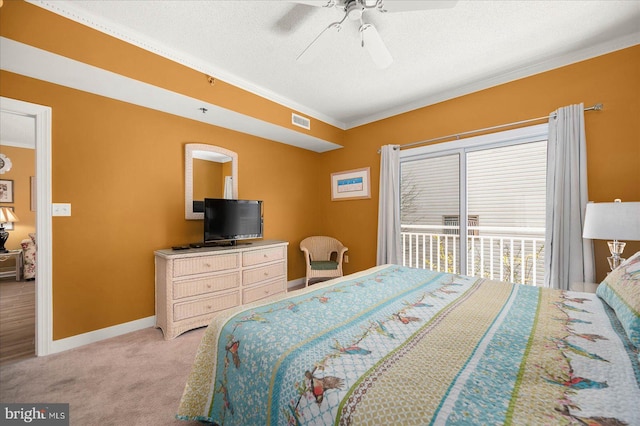 bedroom featuring a textured ceiling, carpet floors, ceiling fan, and crown molding