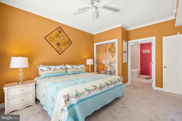 carpeted bedroom featuring a closet, ceiling fan, connected bathroom, and ornamental molding