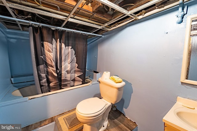 full bathroom featuring vanity, shower / tub combo, and toilet