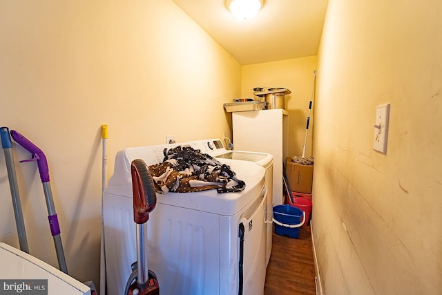 laundry area featuring hardwood / wood-style flooring and separate washer and dryer