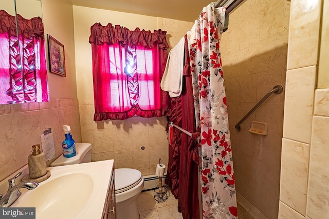 bathroom featuring toilet, tile floors, and tile walls