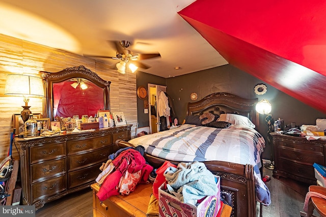 bedroom featuring ceiling fan and dark wood-type flooring