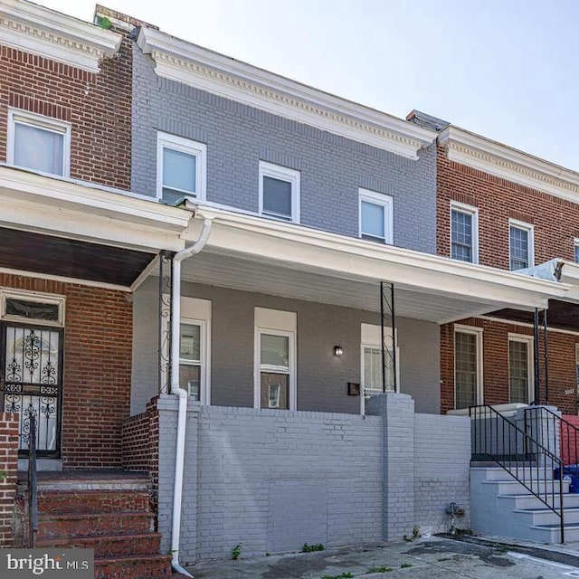 townhome / multi-family property with covered porch