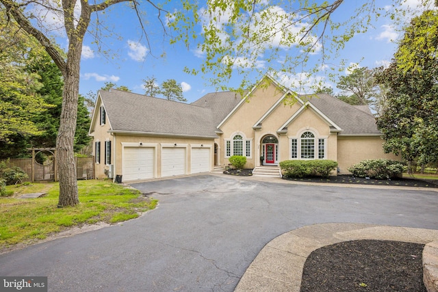 front of property with a garage