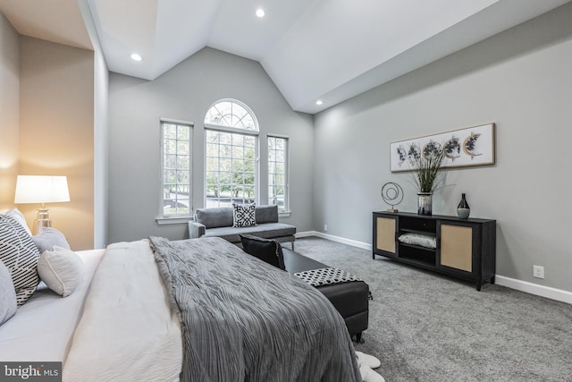 bedroom featuring high vaulted ceiling and carpet