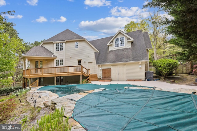 view of swimming pool featuring a deck and a patio area