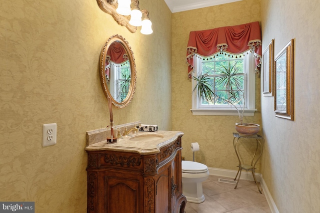 bathroom with toilet, tile flooring, and vanity