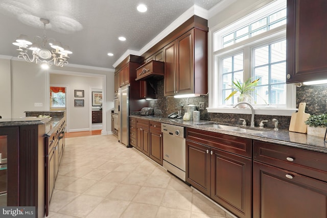 kitchen featuring sink, dishwasher, light tile floors, and dark stone counters