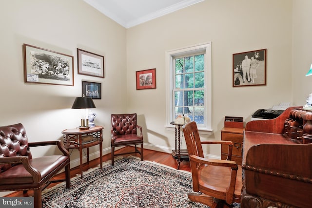 home office with hardwood / wood-style floors and crown molding