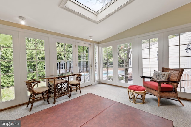 sunroom / solarium with french doors and vaulted ceiling with skylight