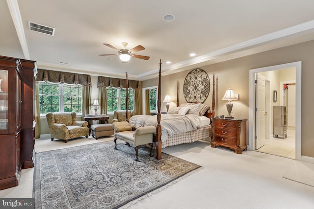 tiled bedroom with ceiling fan, ensuite bathroom, and ornamental molding