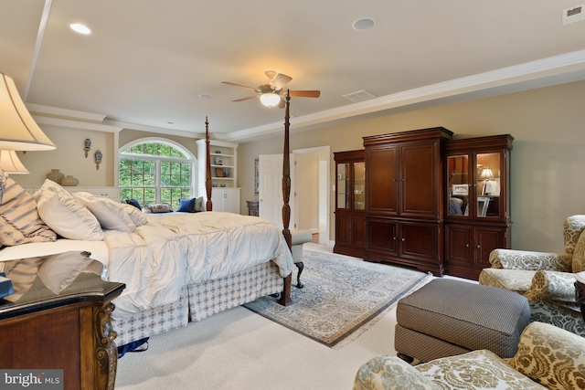 bedroom with ornamental molding, ceiling fan, and carpet floors