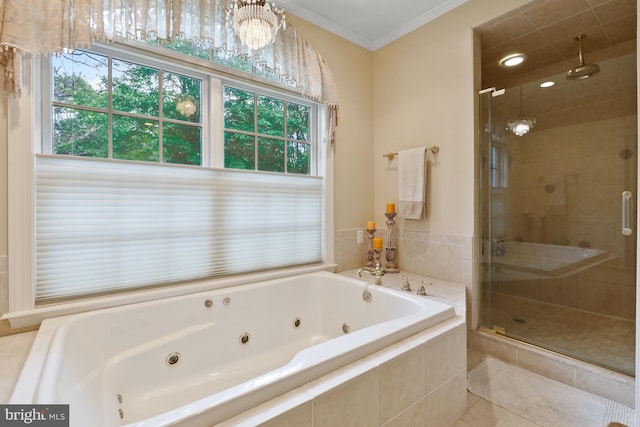 bathroom with ornamental molding, independent shower and bath, and tile floors