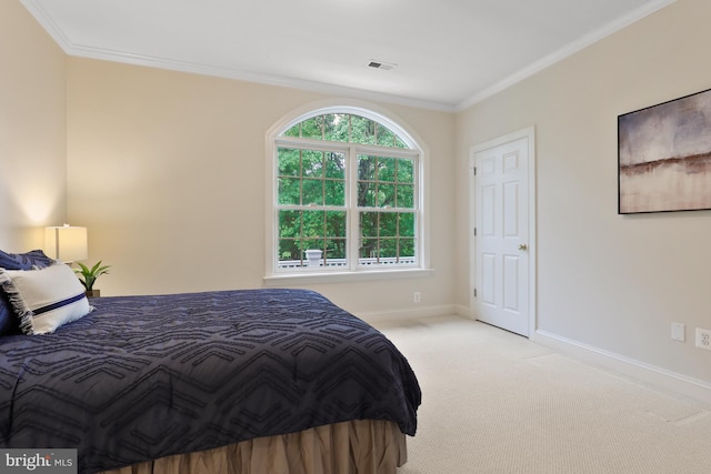 carpeted bedroom with crown molding