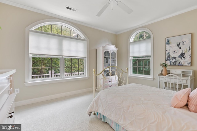 bedroom featuring crown molding, carpet, ceiling fan, and multiple windows