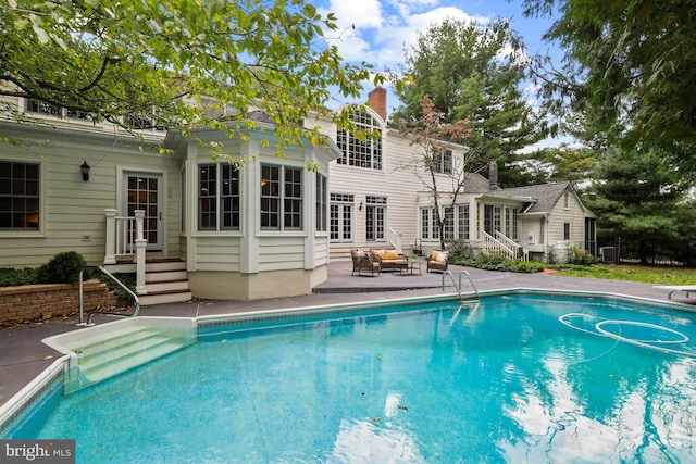 view of swimming pool with a patio