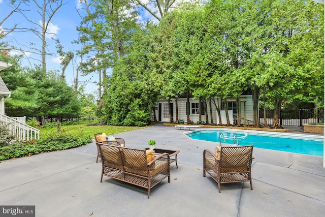 view of swimming pool with a patio