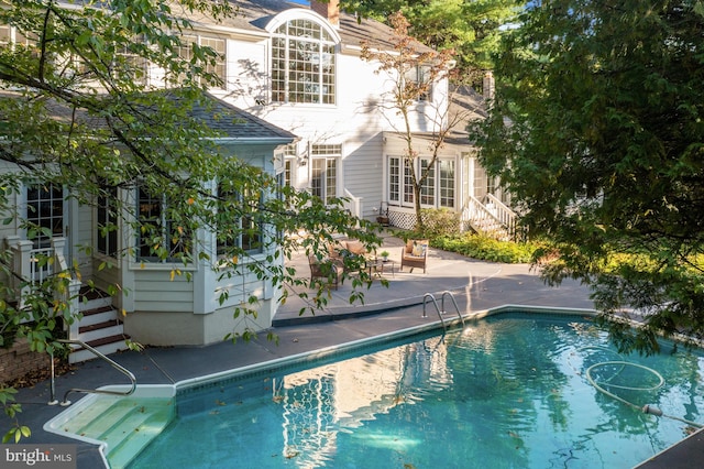 view of pool featuring a patio area