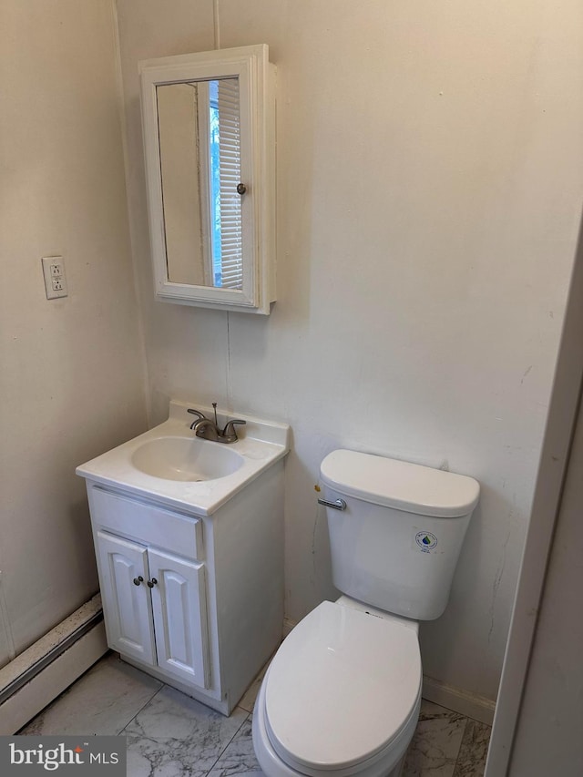 bathroom with vanity, a baseboard radiator, and toilet