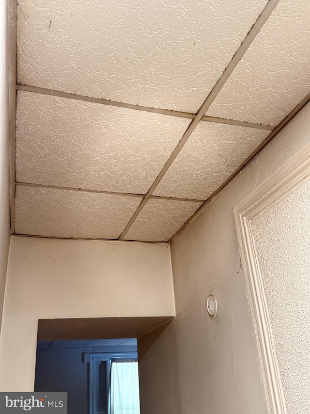 interior details with a paneled ceiling