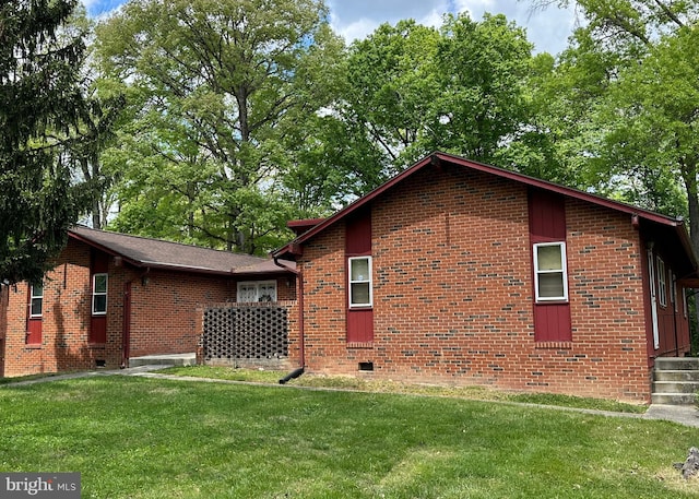 view of home's exterior with a lawn