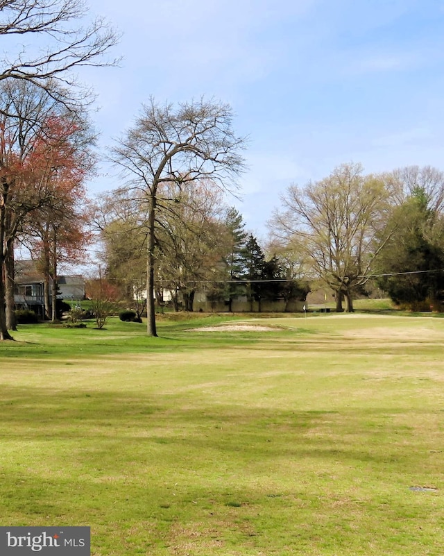 view of home's community featuring a yard