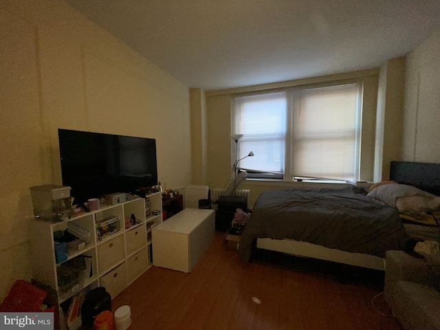 bedroom featuring dark wood-type flooring