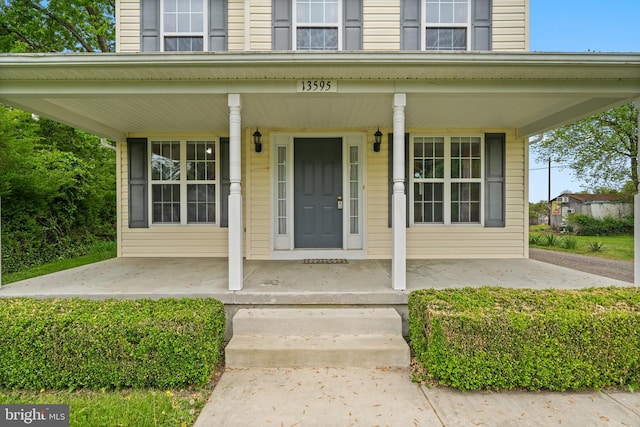 doorway to property with a porch