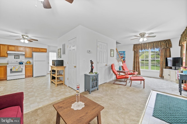 living room featuring ceiling fan and light tile floors