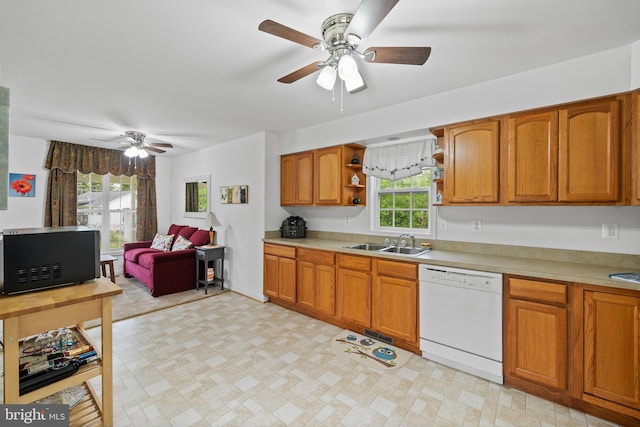 kitchen with sink, ceiling fan, light tile flooring, and white dishwasher