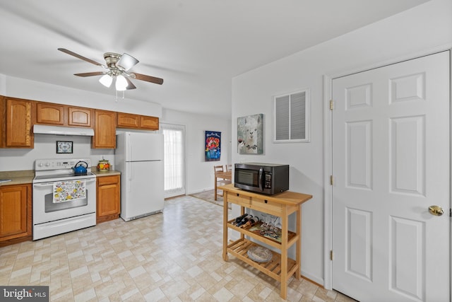 kitchen with white appliances, ceiling fan, and light tile flooring