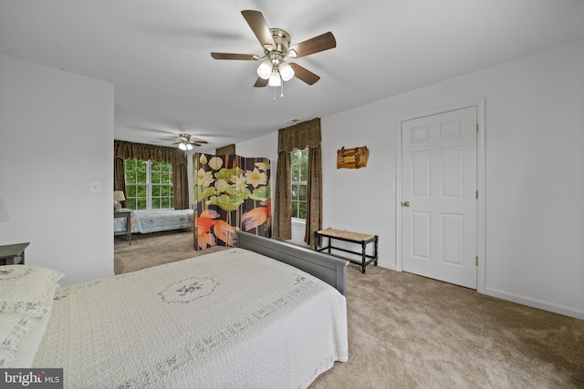 carpeted bedroom featuring ceiling fan