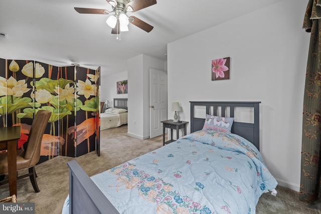 bedroom with ceiling fan and carpet flooring