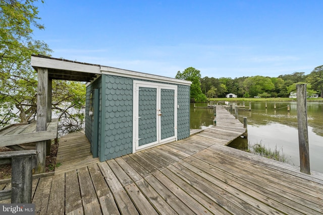 dock area with a water view