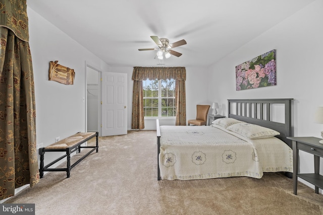 bedroom with ceiling fan and carpet flooring