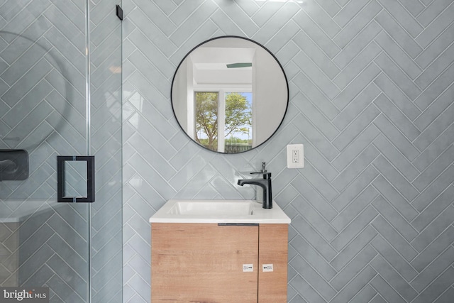 bathroom with tile walls and vanity