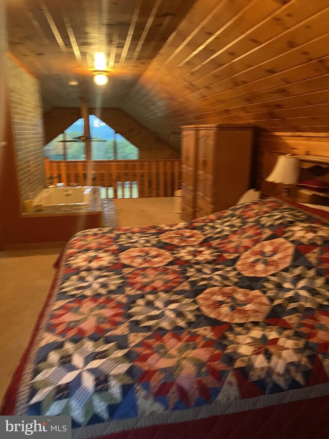 bedroom featuring wooden ceiling and vaulted ceiling