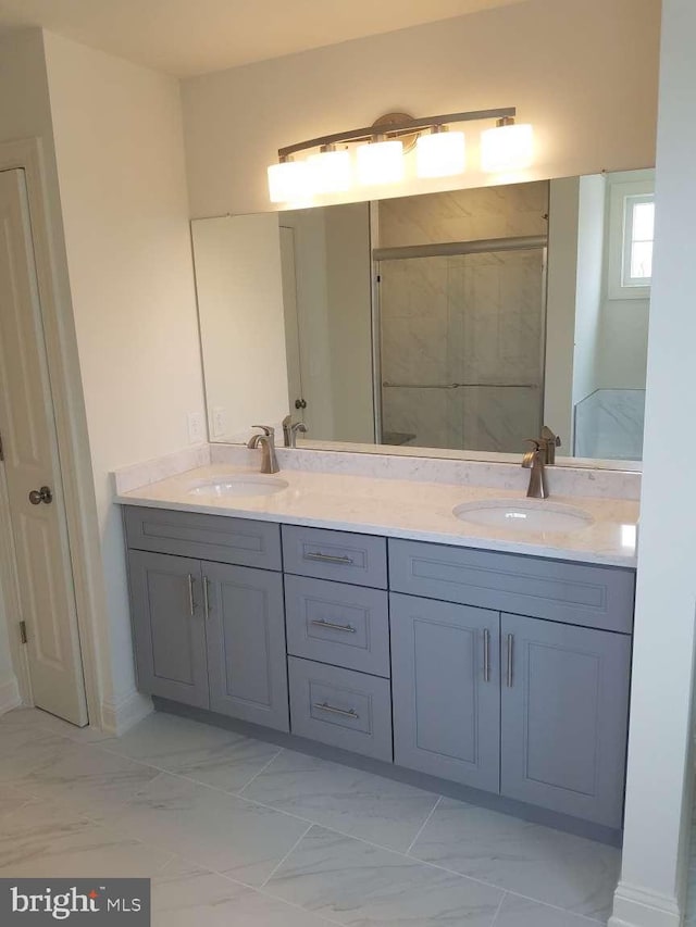 bathroom with walk in shower and vanity