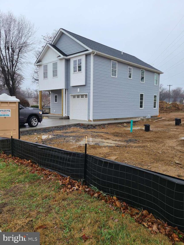 front of property with a garage