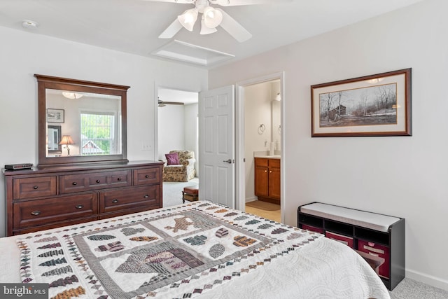 bedroom featuring connected bathroom, ceiling fan, and light carpet