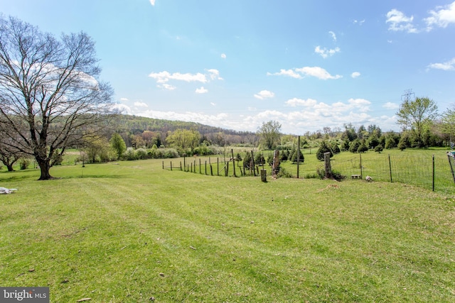 view of yard with a rural view