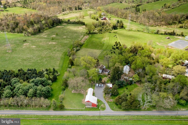 birds eye view of property featuring a rural view