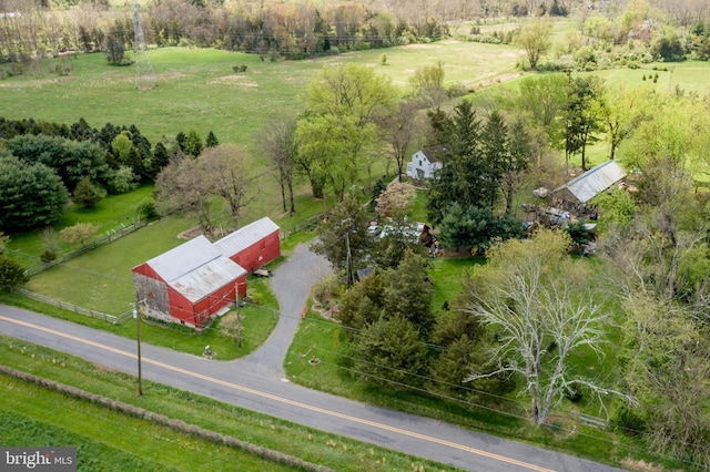 birds eye view of property featuring a rural view