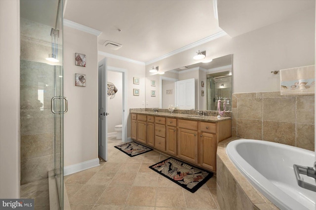 full bathroom with dual vanity, crown molding, toilet, and tile floors