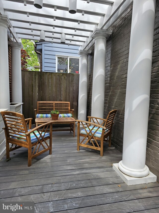 wooden deck featuring outdoor lounge area and a pergola