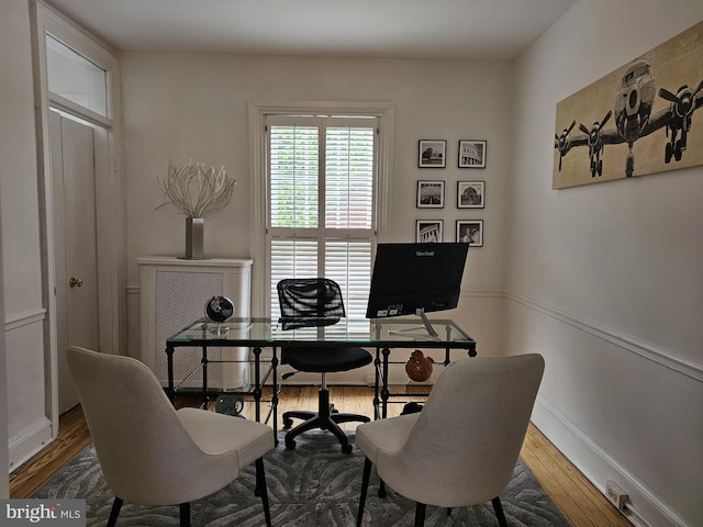 office with hardwood / wood-style flooring